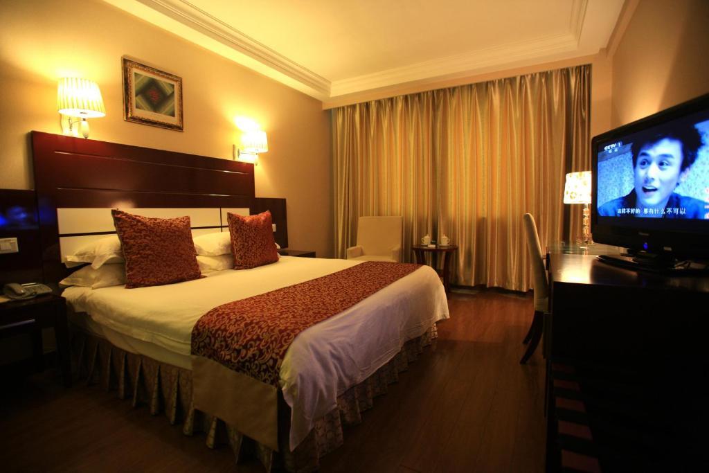 Overseas Chinese International Hotel Thanh Đảo Phòng bức ảnh